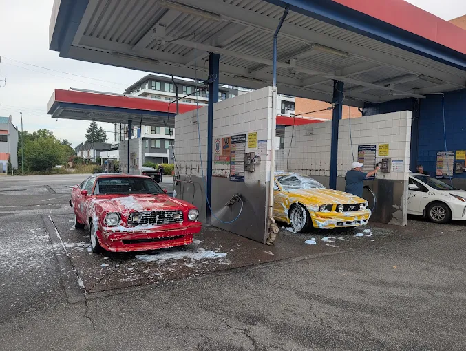 Cars being washed in the self-service wash bays